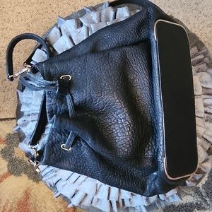 Vince Camuto bucket purse.Black pebble leather like new.  10.5" length 14"width